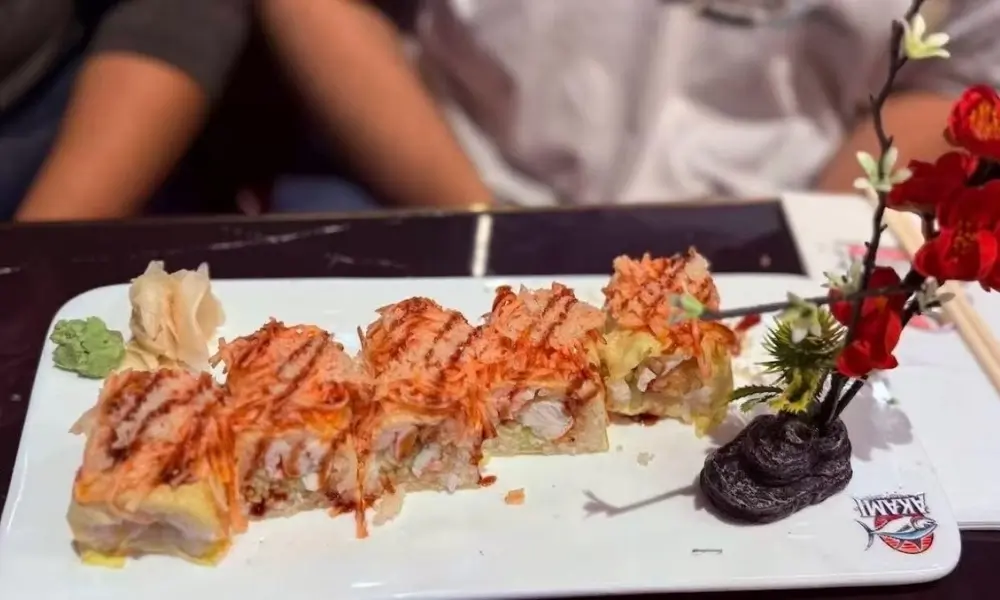 Sushi rolls with green paste and flowers at AKAMI Sushi & Grill,a Japanese Restaurant in Dawsonville