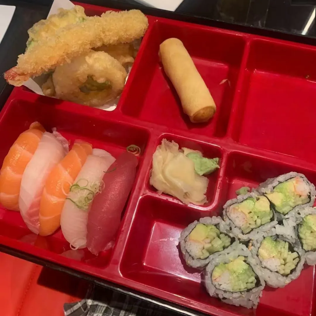 Sushi and tempura in a red bento box at AKAMI Sushi & Grill,a Japanese Restaurant in Dawsonville
